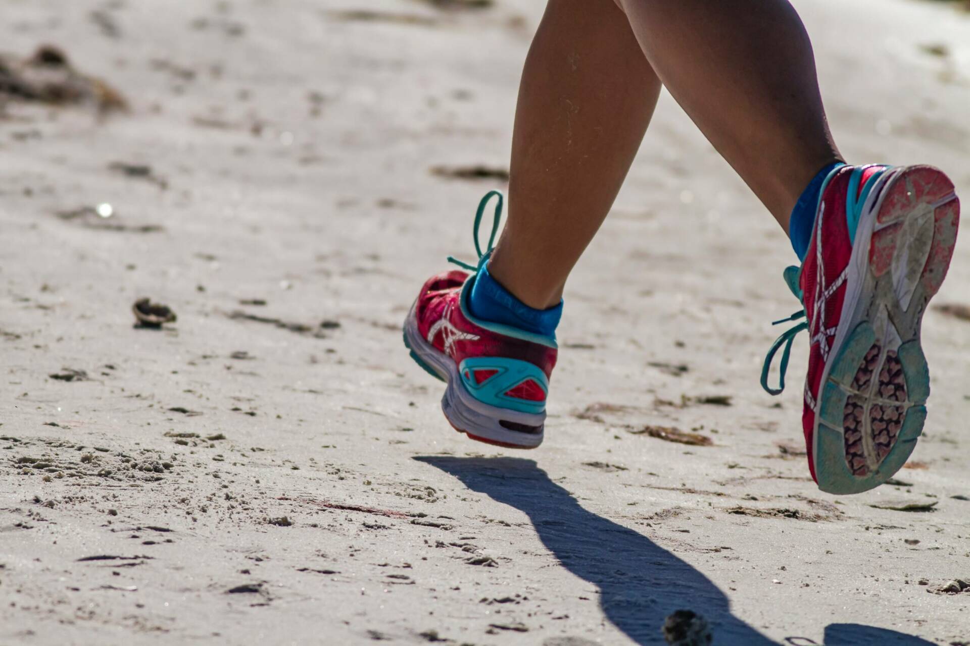 Runner in full stride on the beach