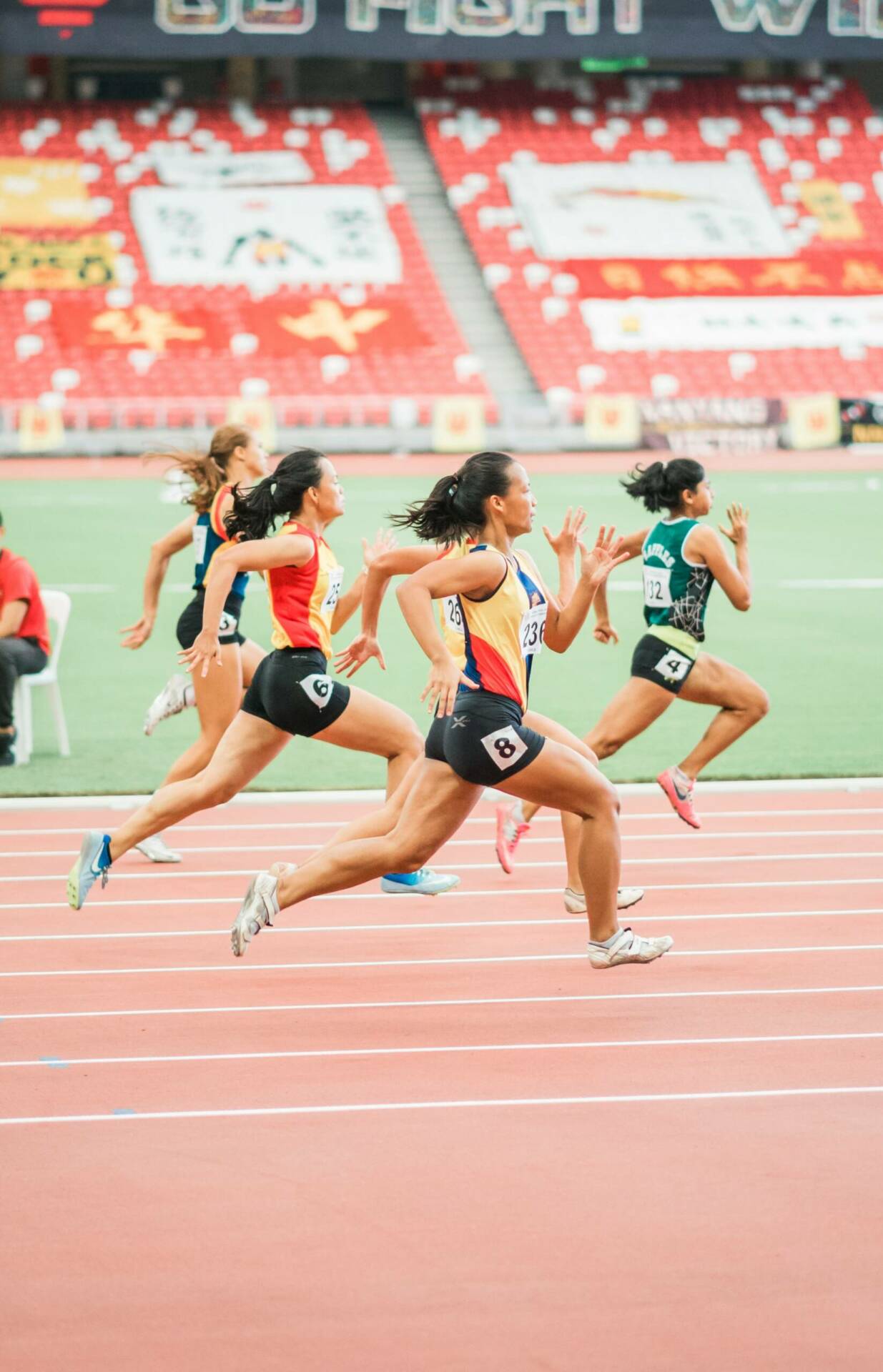 women running on track field